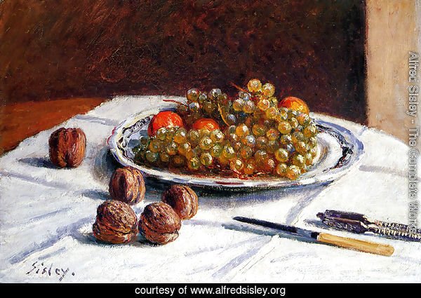 Grapes And Walnuts On A Table